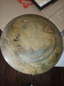 Ornate brass carved bird designs on 10 by 10 Disc.a