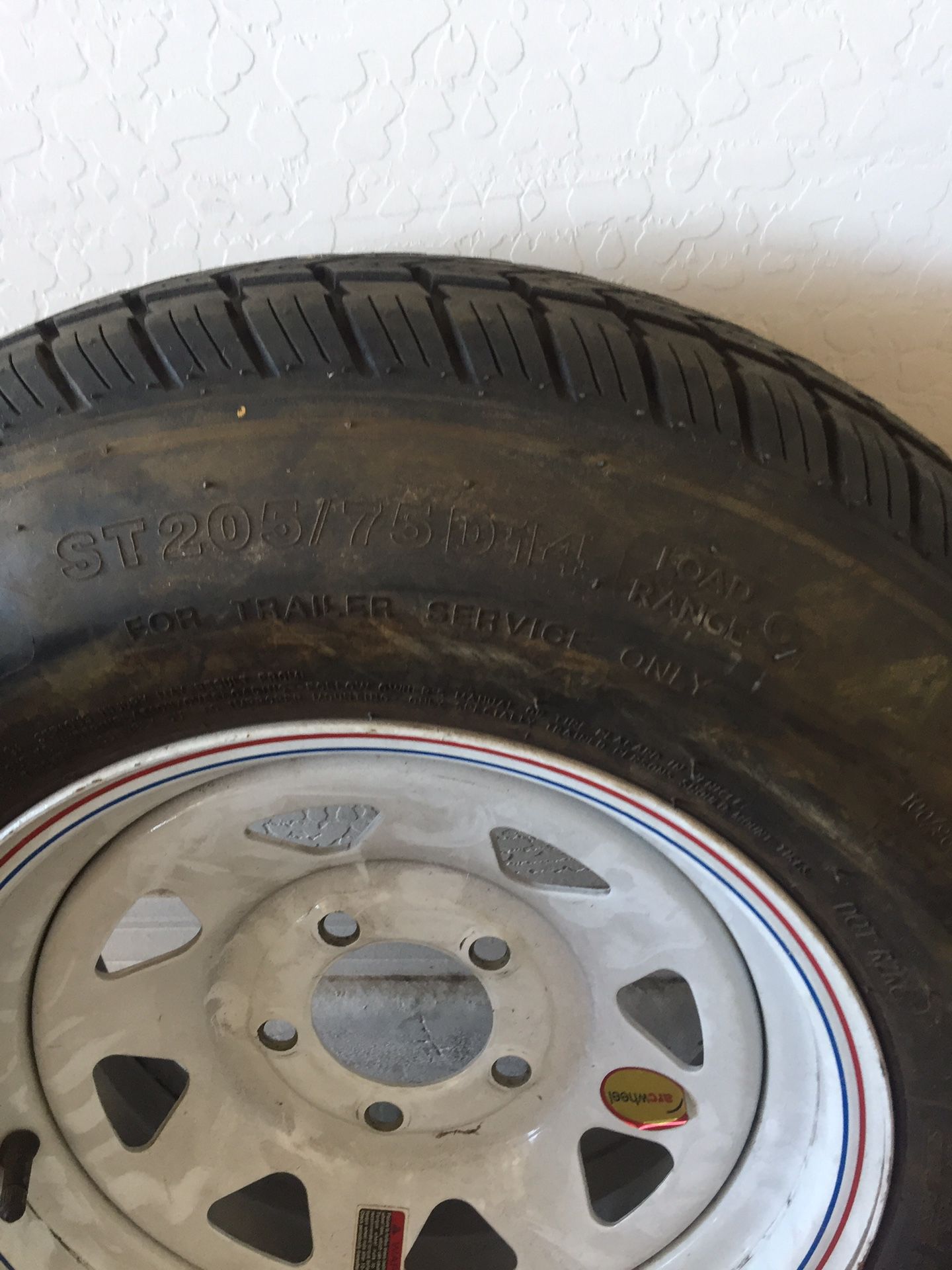 Trailer tire 205/75R14 both tires and Rims are good , boat trailer