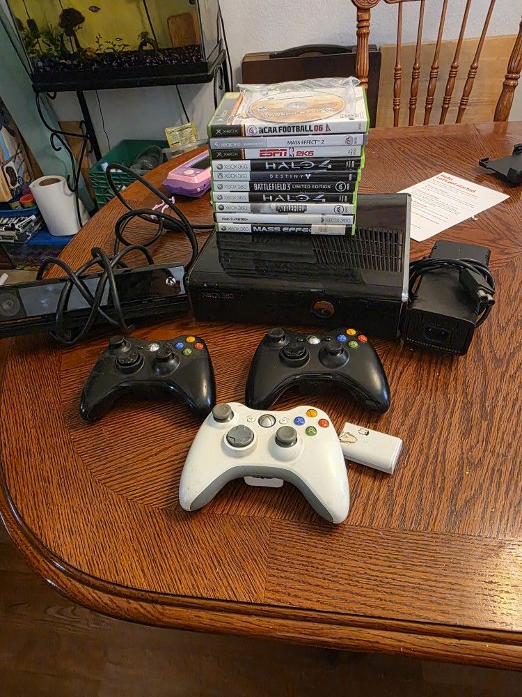 Xbox 360 with controllers and games