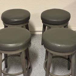 Four Counter Height Swivel Bar Stools
