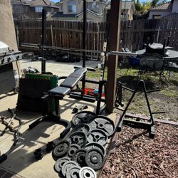  Bench press squat rack with pulley system 250lbs of Olympic plates and 7ft 40lb bar plus weight tree and mats