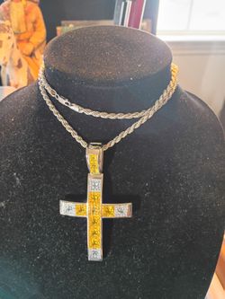 pure Silver Cross 925 on a 925 Italy rope chain 26 in Long the cross itself is 3 and 1/2 in Long with yellow stones