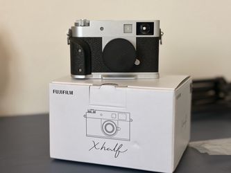 Fujifilm XHalf with small rig grip and SD card