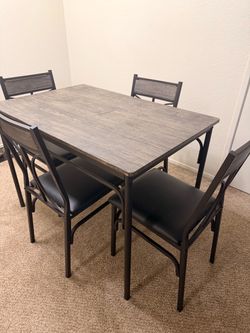 Table and four chairs kitchenette set