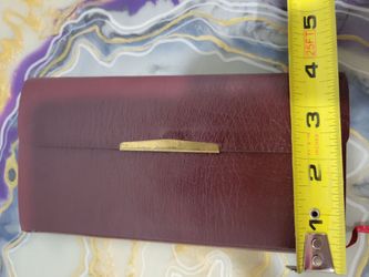 burgundy leather-look New King James Version (NKJV) compact reference edition Bible with a snap-flap closure published by Thomas Nelson
