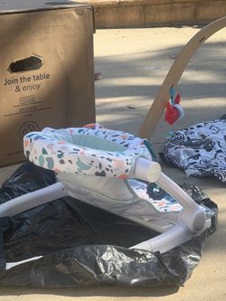 Baby chair and baby tummy time mat w/ accessories.