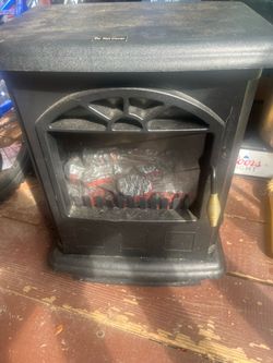 Small  plug in Fire place heats great
