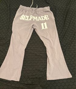 Grey sweatpants with white lettering