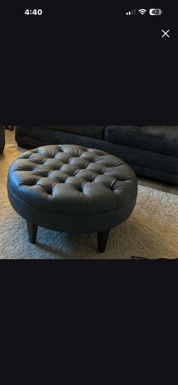 Blue leather ottoman good shape used in bedroom not really used much.