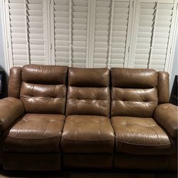 Reclining leather sofa
