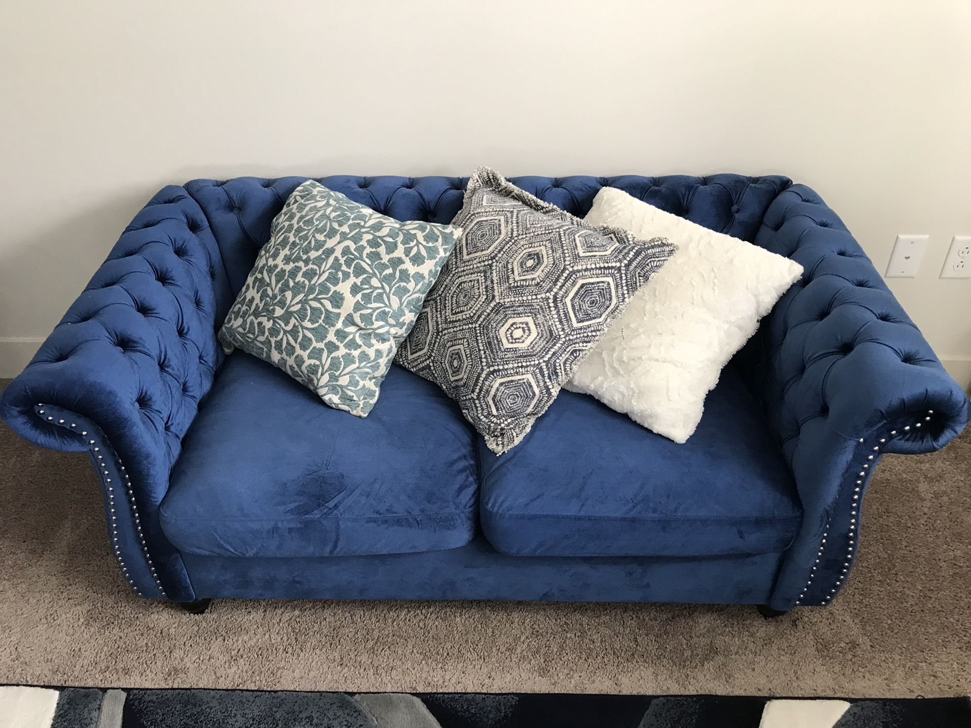 Beautiful Blue Twin Couches With Glass Coffee Table