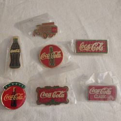 Collection Of Seven Coca-Cola Pins $25
