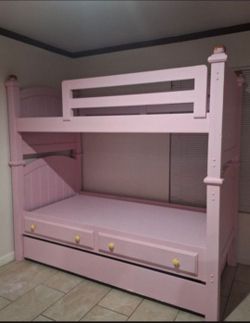 Pink bunk bed with trundle
