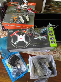 3 helicopters of various sizes, 2 quad drones plus various parts