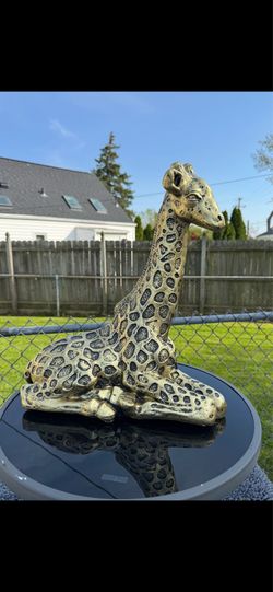 Golden giraffes statue