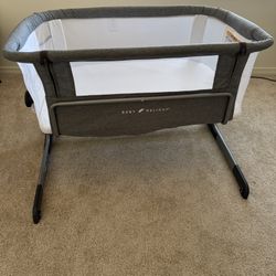 Bassinet. Brand: Baby Delight. Color: Gray and White.