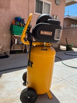 DeWalt Air compressor with Nail gun and hose attachment