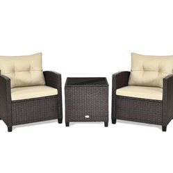 Patio furniture set: two chairs, a table, and a footrest that comes with the chairs