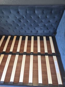 Blue velvet upholstered daybed.