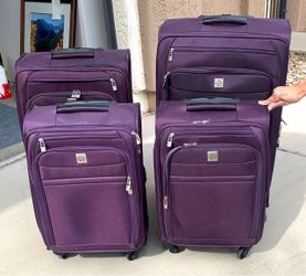 4-Piece Purple Spinner Luggage Set – $40