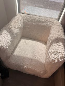2 white swivel couch chair