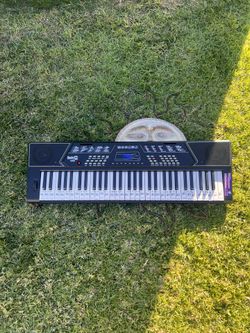New Piano With The Seat And Stand