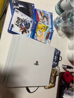 PS4 pro with games and controllers