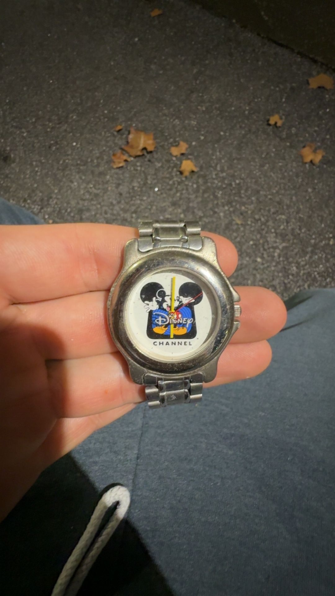vintage Disney Channel Mickey Mouse quartz watch with a silver-tone stainless steel link band
