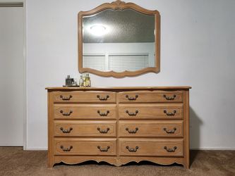 Ethan Allen wood dresser, mirror, and queen headboard.