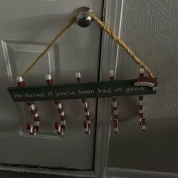 Holds Christmas stockings