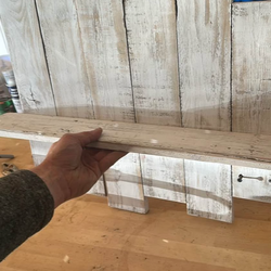 Recovered wood wall shelf.