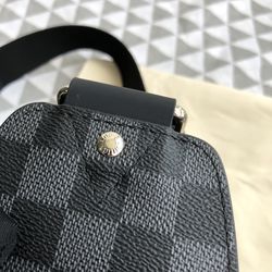 Authentic Louis Vuitton black embossed calfskin diamer sling