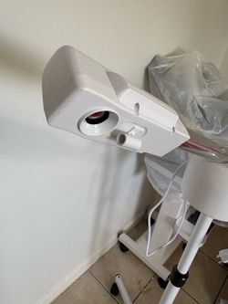 Facial steamer with stand and wells