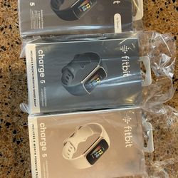 Unopened Fitbit Charge  5. Gold, Blue And Black 