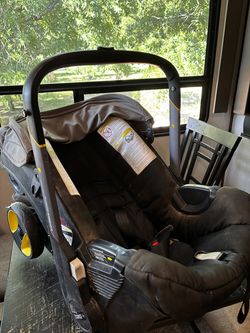 Donna car seat/stiller with base and Micheal Kors diaper bag