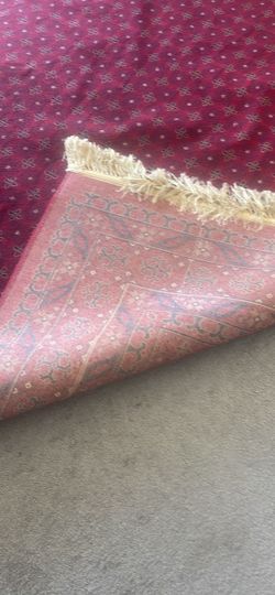 Turkish rug size 10ft by 14 ft in dark red/ burgundy color.