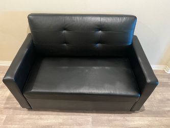 Small faux leather couch with pull out twin bed
