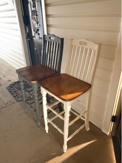Two bar height chairs.