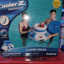 NEW FLOATING COOLER WITH 6 CUP HOLDERS. 