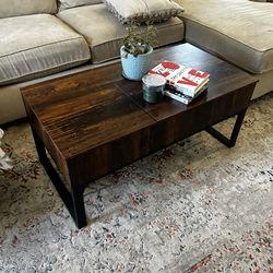 Lift coffee table with sliding barn door and hidden storage