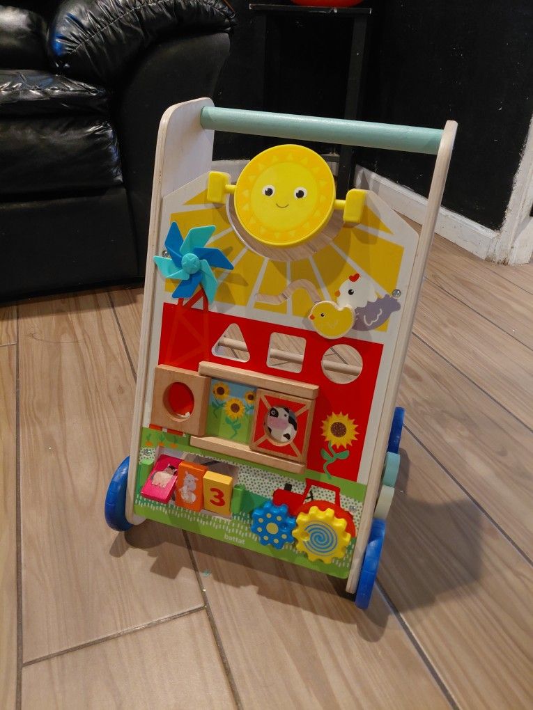 iews
(4.8)|
411
Battat Farm Footsteps Wooden Activity Walker 19.61 in with 3 Shapes, Baby and Toddler Toys