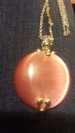 Beautiful rose quartz pendant .size of a fifty cent peice