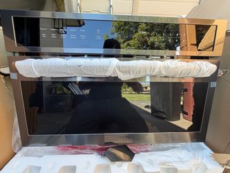 TOP-OF-THE-LINE MICROWAVE 700$$ new includes free delivery
