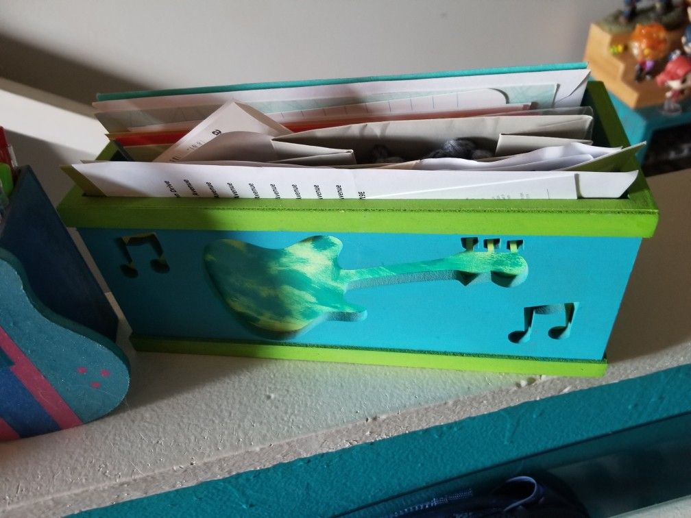 Guitar pencil and letter holder