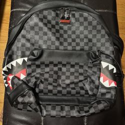 SPRAYGROUND SHARKS IN PARIS (BLACK CHECKERED EDITION) BACKPACK