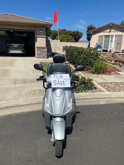 Silver Mobility Scooter with Safety Flag