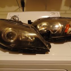 2010-2011 Subaru Impreza Headlamps. (OEM) Bulbs Still Included