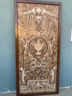 Decorative wall  panel featuring classical motifs.