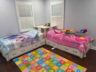 Kid sized twin beds with double drawers