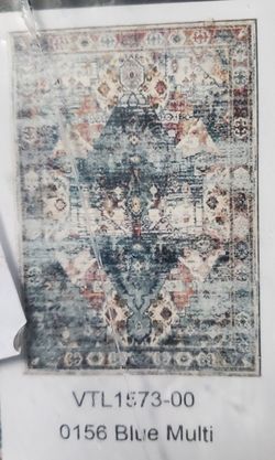 Monolia area rug. New in pack. Size is in the picture.